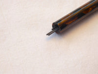 Vintage propelling pencil in marbled brown.